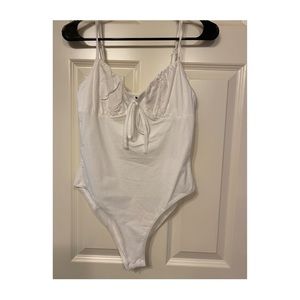 white ruffle bodysuit